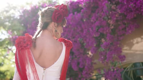 Woman Dancing in Traditional Dress with Red Roses