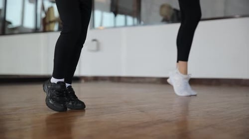 Engaging and Dynamic Dance Moves Performed in a Creative Studio Setting Environment