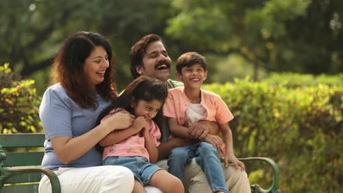 Modern Family Laughing And Enjoying Time In The Park