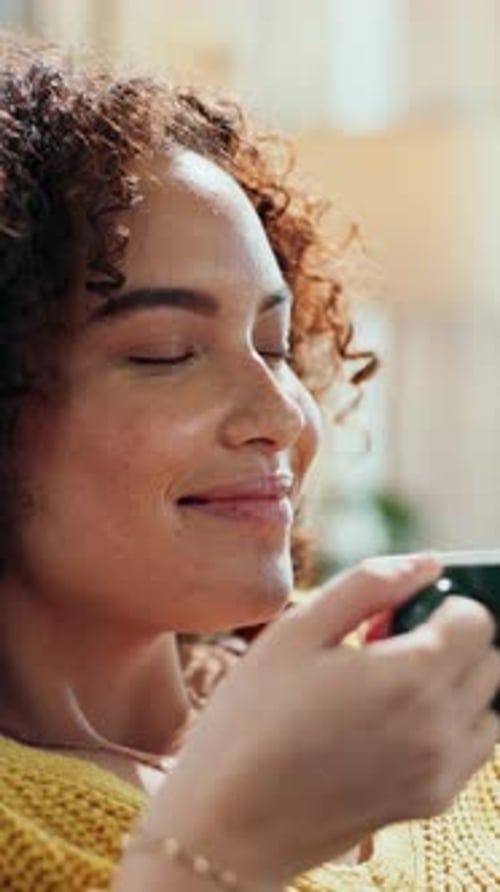 Woman Drinking Coffee Outside, Enjoying the Taste