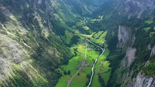 Lauterbrunnen valley with famous church and Staubbach waterfall. Lauterbrunnen village, Berner Oberl