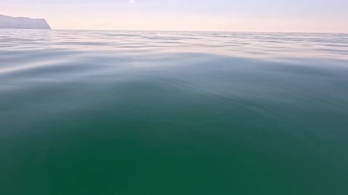 Sea Water Surface Low Angle View Over Clear Azure Sea Water Sun Glare Abstract Nautical Summer Ocean