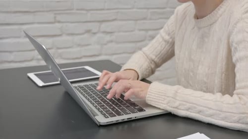 Close up of Female Hands Typing on Laptop