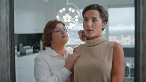 Woman Consulting with Doctor in Medical Clinic