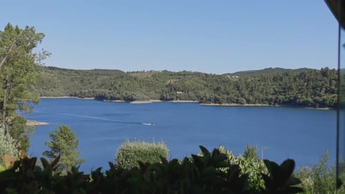 Small Motorboat Crossing Lake in Slow Motion