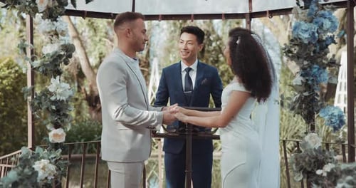 Couple, wedding and ceremony with marriage in support or hands to celebrate, commitment in garden