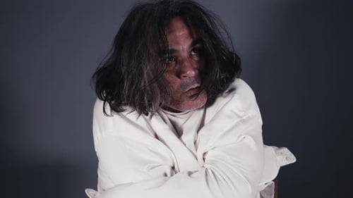 Distressed Adult Wearing Straight Jacket Close Up