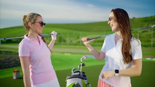 Women High-Fiving on a Sunny Golf Course