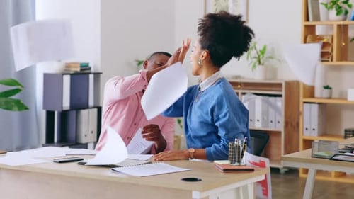Paper throw, employee and office high five of business people with celebration from teamwork