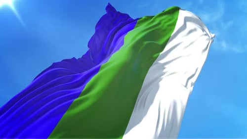 Vibrant Three Color Flag Waving Against Clear Blue Sky