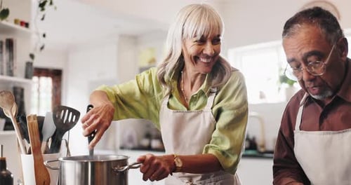 Couple Cooking Together in Bright Kitchen