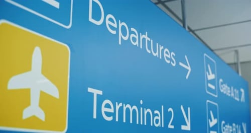 Airport Sign Indicating Departures and Terminal Information