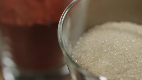 Closeup of glass jar with refined white sugar