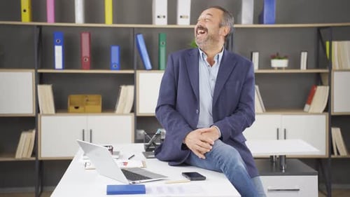 Excited Man Celebrating Success in Office