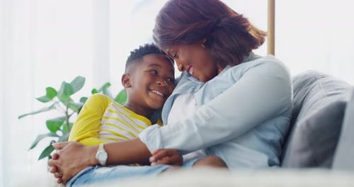 Loving Mother and Child on Couch Together