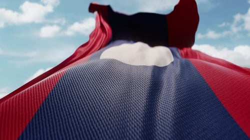 Laos National Flag Waving in the Wind with Cloudy Sky