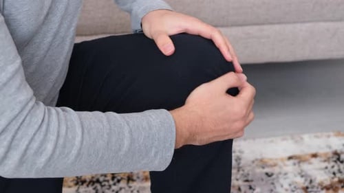 Massaging His Knee
