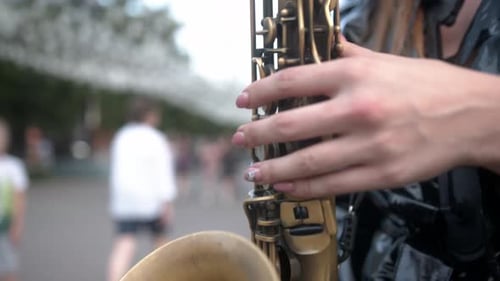 Saxophone Player Performing Outdoors in Urban Park