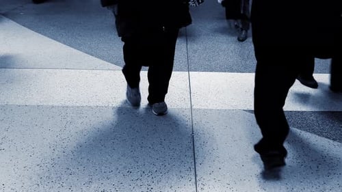 Pedestrians Commuting on Crowded Street in Rush Hour Traffic