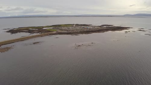 Drone ascends to Mutton Island watewater treatment plant in Galway Bay