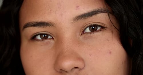 Happy Hispanic woman smiling close-up eyes. macro closeup latina south american woman