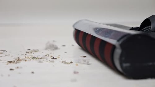 Vacuum Cleaner Head Sucks Up Dirt Close Up