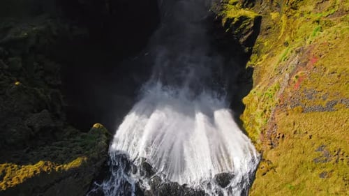 Breathtaking Aerial View of Waterfall and Natural Landscape