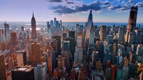 Dazzling sun lighting the tops of the skyscrapers in New York downtown.