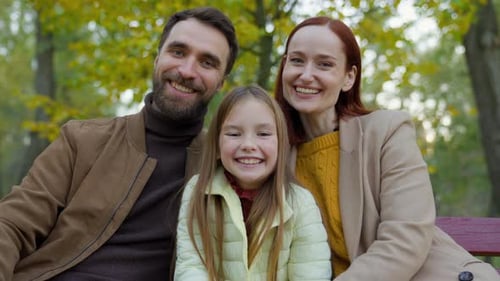 Happy Caucasian Family Parents Mother Father Daughter Child Girl Kid Daughter at Autumn Park