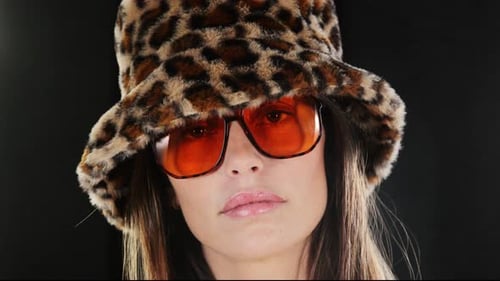 Woman with Leopard Print Hat and Orange Glasses
