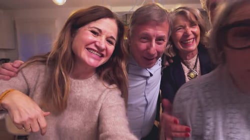 Smiling Adults Enjoying a Group Video Call at Home