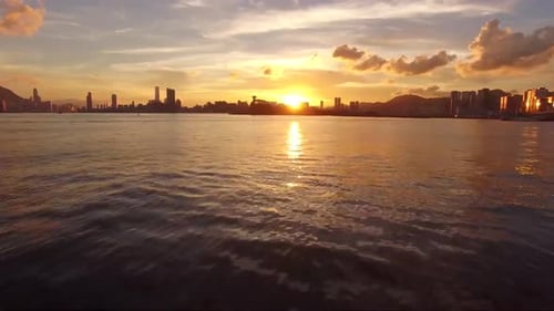 Sunset flight over the town of Seaview 4k