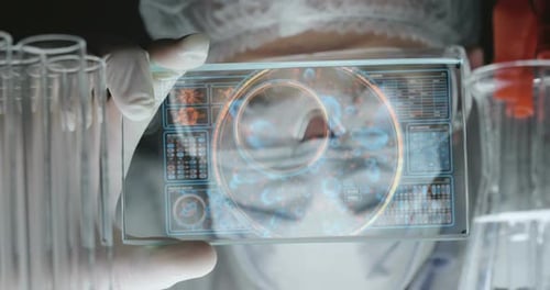 A futuristic physician, a surgeon, examines a technological digital holographic plate, a medical m