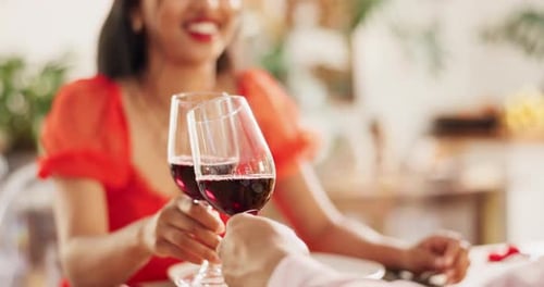 Woman and Man Toasting Wine at Romantic Dinner