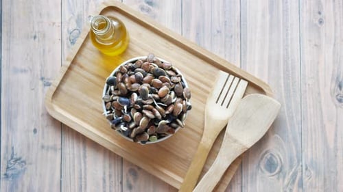 Healthy Assorted Seed Mix in Bowl on Wooden Platter