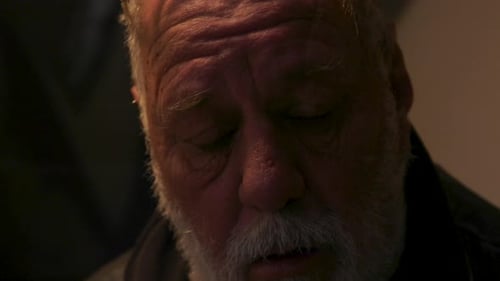 An elderly male man looking sad and about to cry, deep in thought. CLOSE UP.