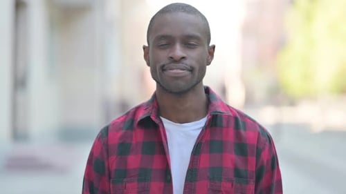 Smiling Man in Red Flannel Shirt