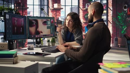 Man and Woman Creative Team Using AI to Generate Image Models