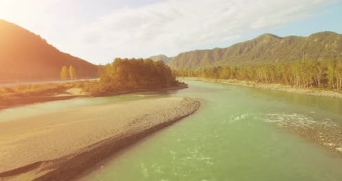 UHD Aerial View Low Flight Over Fresh Cold Mountain River at Sunny Summer Morning Green Trees and