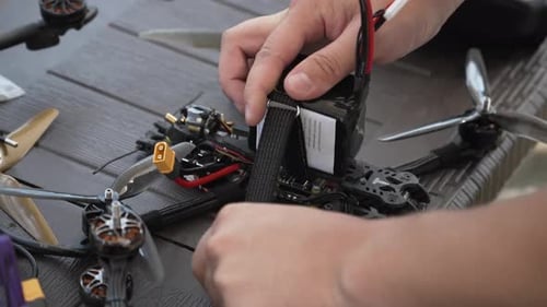 A Man Prepares an FPV Drone Before a Flight