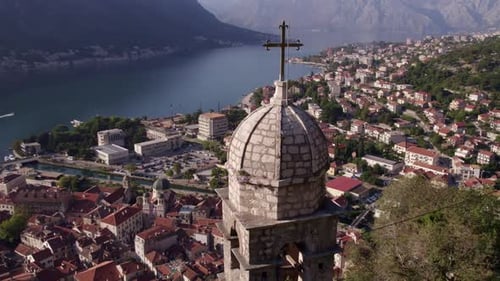 Aerial view of medieval city with church overlooking Kotor Bay, Montenegro.