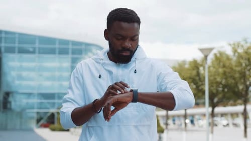 Close Up Young African American Man Use Smartwatch Stand Street Business Shopping Internet Face
