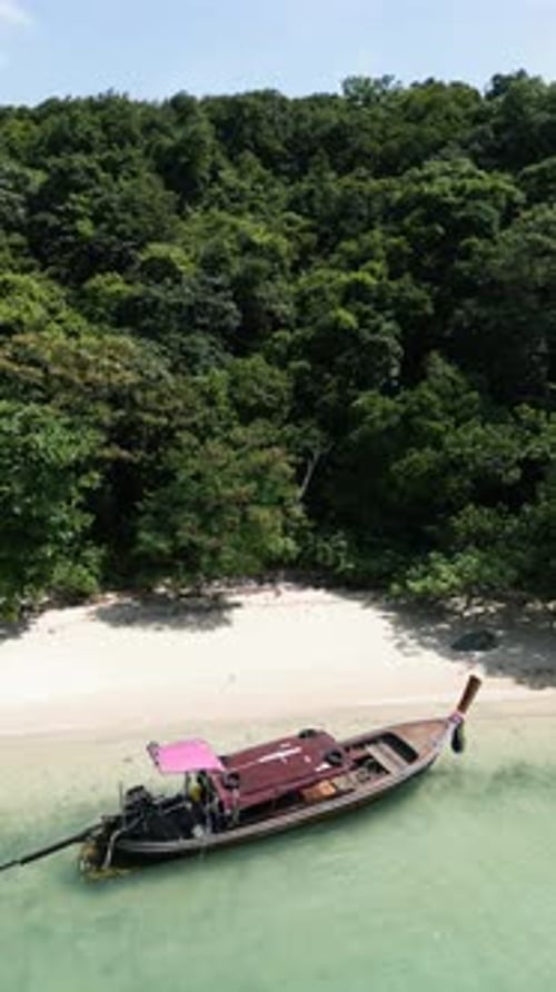 Vertical Video Aerial View Overhead a Sailboat Exploring a Tropical Coastal Bay
