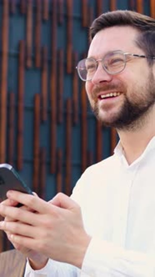Portrait of Businessman Stand in City Center Street Uses Phone Texting Scrolling Typing Message at