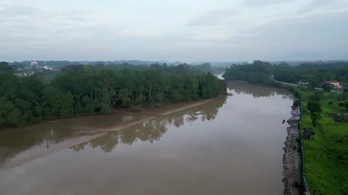 A river with a brownish color. Aerial view Sungai Johor at Kota Tinggi, Johor