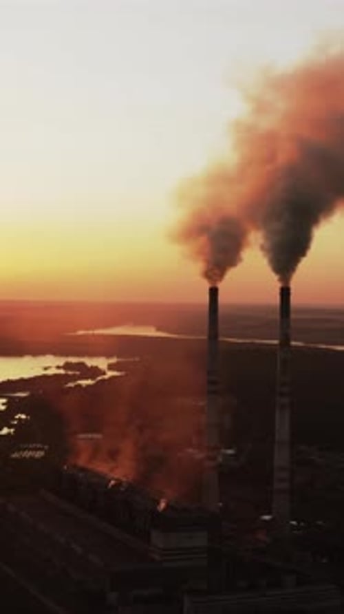 Static view of the power pylons on sunset time background. High voltage electric tower at the sunset