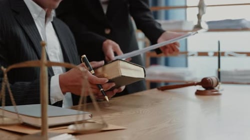 Legal Professionals Collaborate in Office Environment