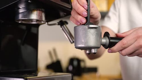Freshly Ground Coffee in a Port Filter Horn for a Coffee Machine