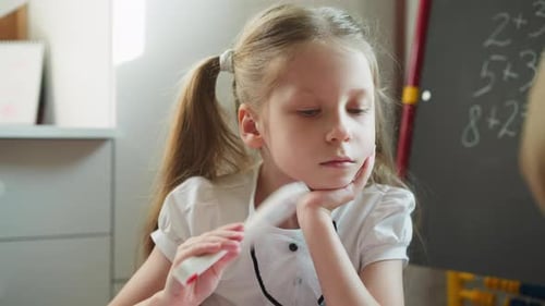 Girl Studies with Flashcards at Home