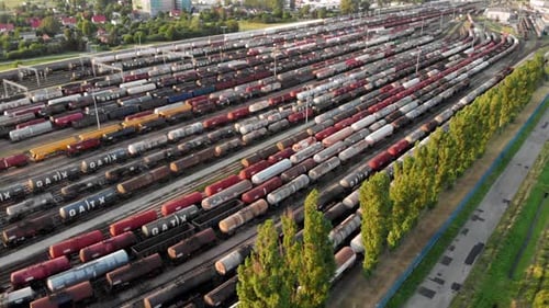 Aerial shot Showing Large Train Depot With Many colorful cargo Trains